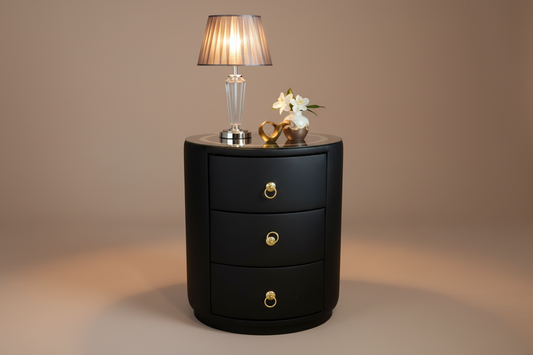 Styled studio lifestyle shot of black barrel nightstand