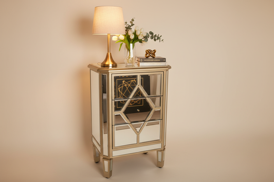 Styled studio lifestyle shot of geometric mirrored nightstand